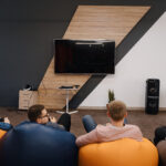 The growth share scenario of the global fiber HDMI 2.1 cable market and sales on Amazon platform 3 it team play video games console while relaxing after work